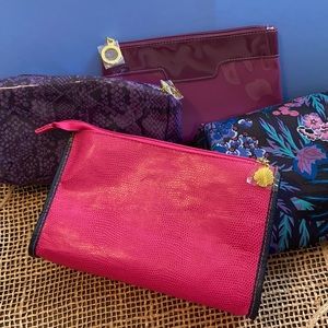 Set of four (4) Estee Lauder makeup bags